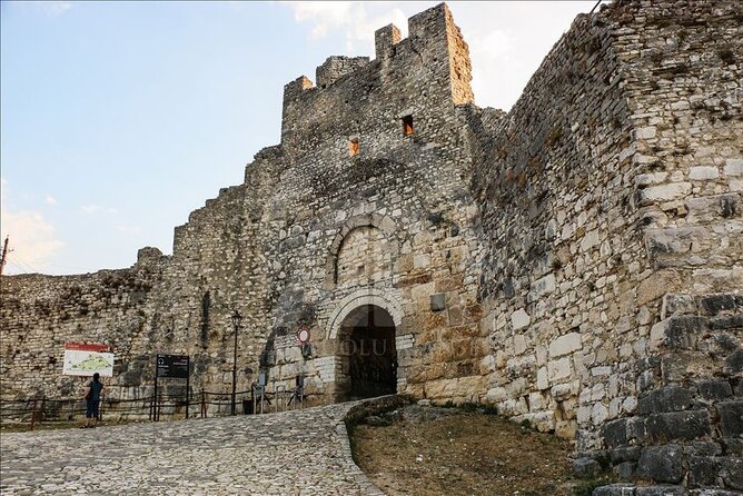 Full Day Tour in Belsh Lake and Berat Town from Tirana - Mangalem leads uphill to a living castle