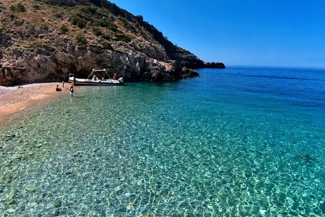 Private Full Day Boat Expedition to Grama Bay - Dafina Beach and a cave reached by swimming