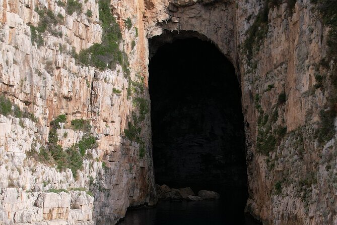 Vlore Private Boat Tour Blue Cave & Grama Bay Adventure - Bristani Bay adds bunkers to the beach day