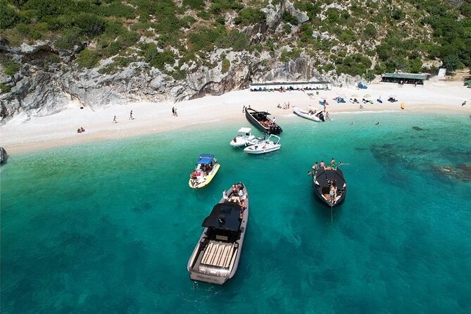 Vlore Private Boat Tour Blue Cave & Grama Bay Adventure - Dafina Bay trades crowds for wild coastline